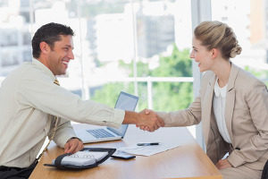 small business owner shaking hands with a contractor
