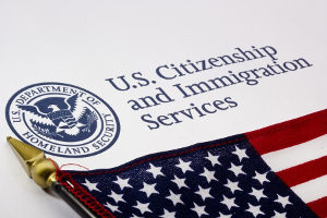 logo of the USCIS, who issues L-1A visas