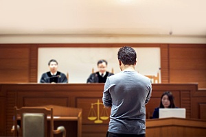 a man being tried in a foreign court while attempting to have his case domesticated in the US
