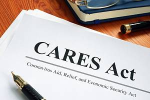 CARES act document sitting on desk 