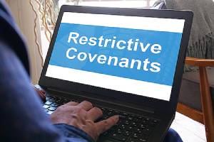 Restrictive covenant on laptop screen